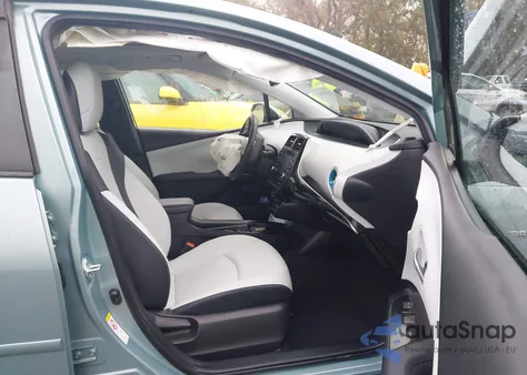 2021 Toyota Prius Xle z USA, uszkodzony, nr VIN JTDKAMFU2M3147447